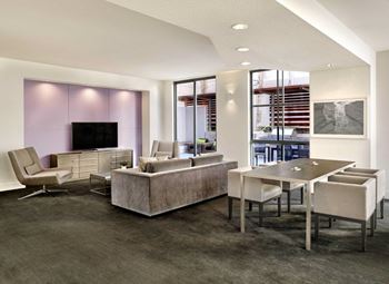 a rendering of a living room with tables and chairs